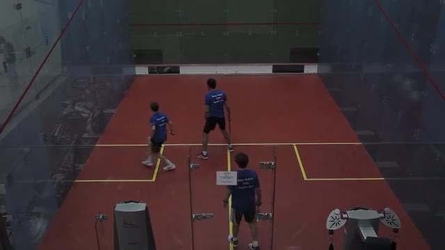 Campers training on a glass court at a Ramy Ashour camp